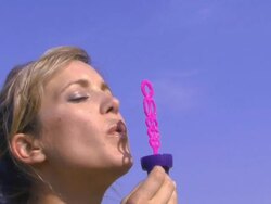 Woman blowing bubbles; UK Stock Footage