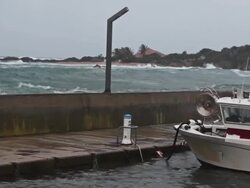 Storm waves breacking on the harbor wall Stock Footage
