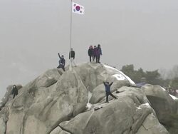 WS AERIAL ZO View of climbers on mountain / Seoul, South Korea Stock Footage