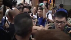 HONG KONG - Hong Kong - Scuffles as pro democracy campaigners shave heads in protest against Beijing / Police use tear gas to try and clear protesters outside government headquarters / Tear gas fired into crowd and police barriers destroyed in pro-democracy protest / Pro-democracy demonstration undeterred by heavy rain News Clip