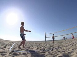 Men playing beach volleyball. - Slow Motion - filmed at 240 fps Stock Footage
