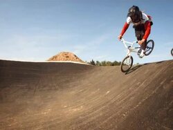 HD SLOW MOTION: Bmx Riders Jumping On The Track Stock Footage