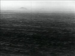 B/W 1936 dust blowing over dusty plain in storm / Dust Bowl / USA Stock Footage
