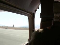 MS POV View of Mature pilot taxiing small aircraft before takeoff / Missoula, Montana, USA Stock Footage