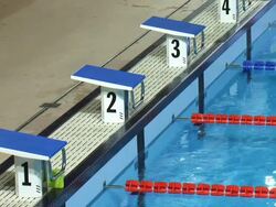 Starting blocks of an olympic swimming pool Stock Footage