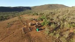 Aerial view over a small African Village Stock Footage