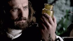 Nostradamus measures powder from a jar into a bowl. Stock Footage