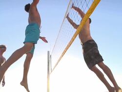 Men playing beach volleyball. - Slow Motion - filmed at 240 fps Stock Footage