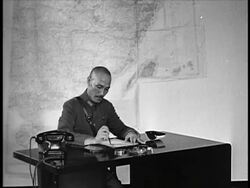 B/W 1940s Chiang Kai-Shek writing at desk / China / documentary Stock Footage