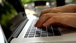 Closeup On Woman's Hand Typing On A Laptop Keyboard Stock Footage