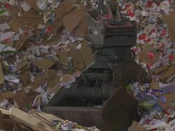 Shifting Cardboard Waste in a Recycling Center Stock Footage
