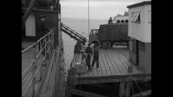 MS Workers unload boxes from truck to cargo ship / United States Stock Footage