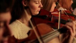 Violinists in orchestra Stock Footage