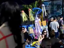 People in street patio or restaurant during Dundas West Festival Stock Footage