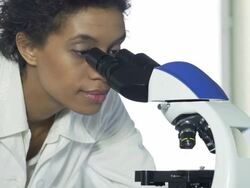Scientist using microscope Stock Footage