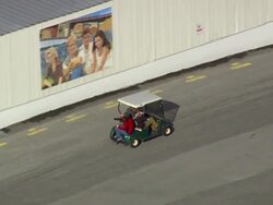 MS AERIAL TS Shot of worker travelling through club car at Screen Gems Studio company / North Carolina, United States Stock Footage