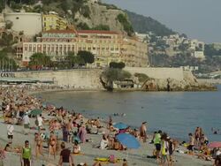 Wide shot of people enjoying French beach / Nice, France Stock Footage