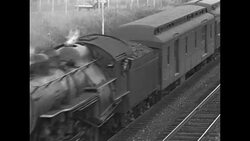 Freight trains moving through countryside in US News Clip