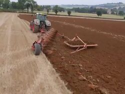 Aerial view of Tractor Ploughing Stock Footage