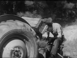 1952: LANEBURG HIGH SCHOOL FOREST: VS Male driving tractor, Laneburg H.S. student riding behind planting seeds (trees). Sowing, reforestation, reforesting, Nevada County, Arkansas, AR Instructional Video