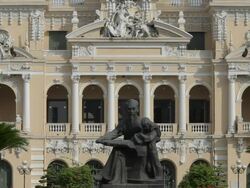 MH LD Vietnam City Hall with Statue of Vietnam in Foreground / Vietnam Stock Footage