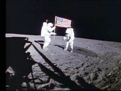 1971 WS Two astronauts (Alan Shepard and Edgar Mitchell) planting American flag on Moon [Apollo 14] Stock Footage