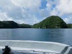 Speed boat crossing the Channel between Rock Islands in Palau Stock Footage