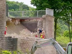 MS Workers working at deconstruction of bridge over river Mosel / Wellen, Rhineland Palatinate, Germany Stock Footage