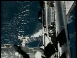 The astronauts aboard the linked shuttle and space station geared up to inspect a damaged thermal blanket on Atlantis on Sunday after their main job - installing the Columbus lab - was delayed a day because of a crew medical problem News Clip