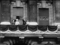B/W 1945 British royalty waving from balcony on V-E day / newsreel Stock Footage