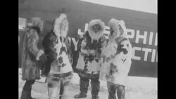 Richard E. Byrd and Floyd Bennett bid farewell to their crew as they prepare to fly over the North Pole News Clip