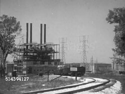 1953: SANTEE COOPER PROJECT: AERIAL: WS Dam & cleared area w/ hydroelectric power plant generating station. VS Station, dam, power lines, transformers, row of power towers, MS Large transformers, WS Squared power transfer grid w/ more transformers. Instructional Video