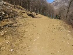 HD: Downhill Bikers Jumping Over Dirt Jumps Stock Footage