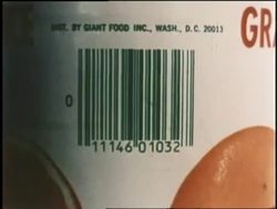 A cashier scans a bar code on a can of juice. News Clip