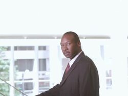  ZI Businessman turning head and smiling / Seattle, Washington, United States Stock Footage