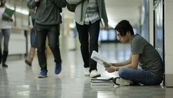 Young adult males bullying another student Stock Footage
