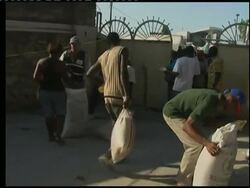 Chaos erupts as US aid group tries to distribute supplies Instructional Video