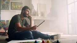 Young artist on the phone Stock Footage