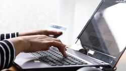 Shopping online on laptop computer with credit card Stock Footage