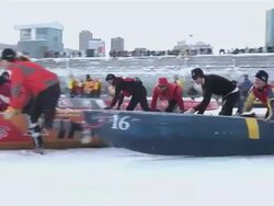 MS TS Ice canoe racing across St. Lawrence River at Quebec Winter Carnivalr AUDIO / Quebec City, Quebec, Canada Stock Footage