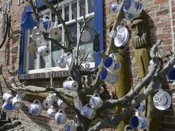 MS Shot of Cups on Tree at Pottery shop  / Middelhagen, Rugen/Mecklenburg, Germany Stock Footage