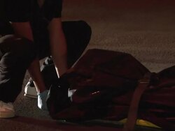 MS PAN ZI ZO Shot of Mexican medics put victim in body bag and keep in van on streets AUDIO / Ciudad Juarez, Juarez, Mexico Stock Footage