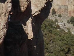 WS Looking far away on climber makes difficult moves up steep rock face / Canon City / Shelf Road,CO,USA Stock Footage