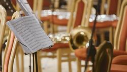 Sheet music with musical instruments on stage Stock Footage