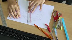 Female architect drawing house in office Stock Footage