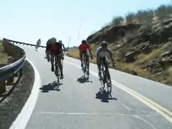 cyclists coming downhill Stock Footage