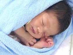 Sleeping baby Wrapped in a Blanket Stock Footage