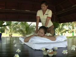 MS Lady receiving oriental massage at outdoor / Sihanoukville, Cambodia Stock Footage