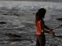 MS TS Man spinninig poi balls with ocean / Montezuma, Punteranes, Costa Rica Stock Footage