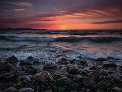 Pebble Coast Sunset Stock Footage